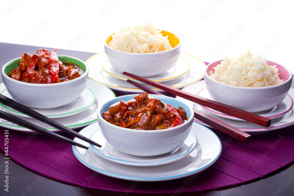 Chinese bowls with rice and sweet and sour chicken