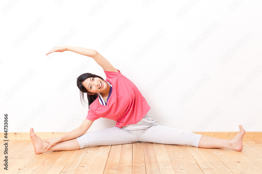 a beautiful asian woman streching 