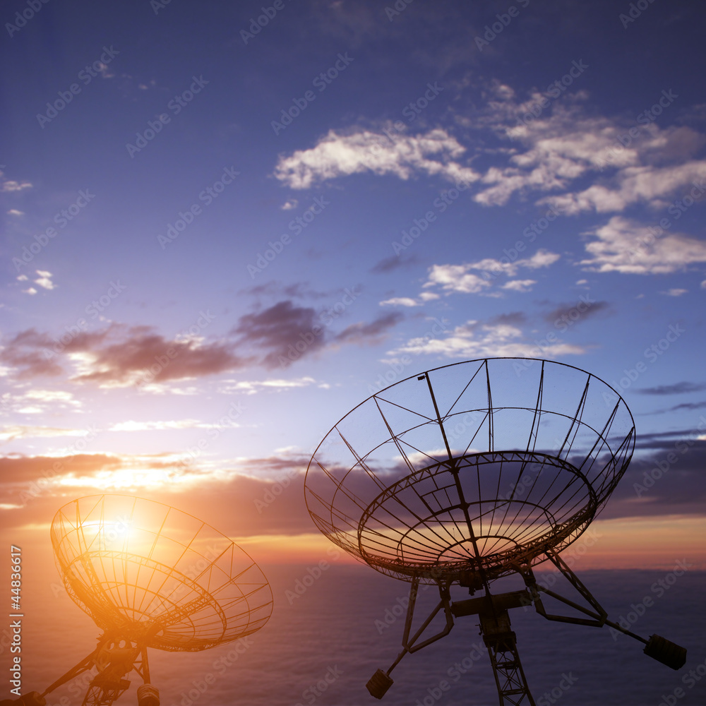 satellite dishes with blue sky