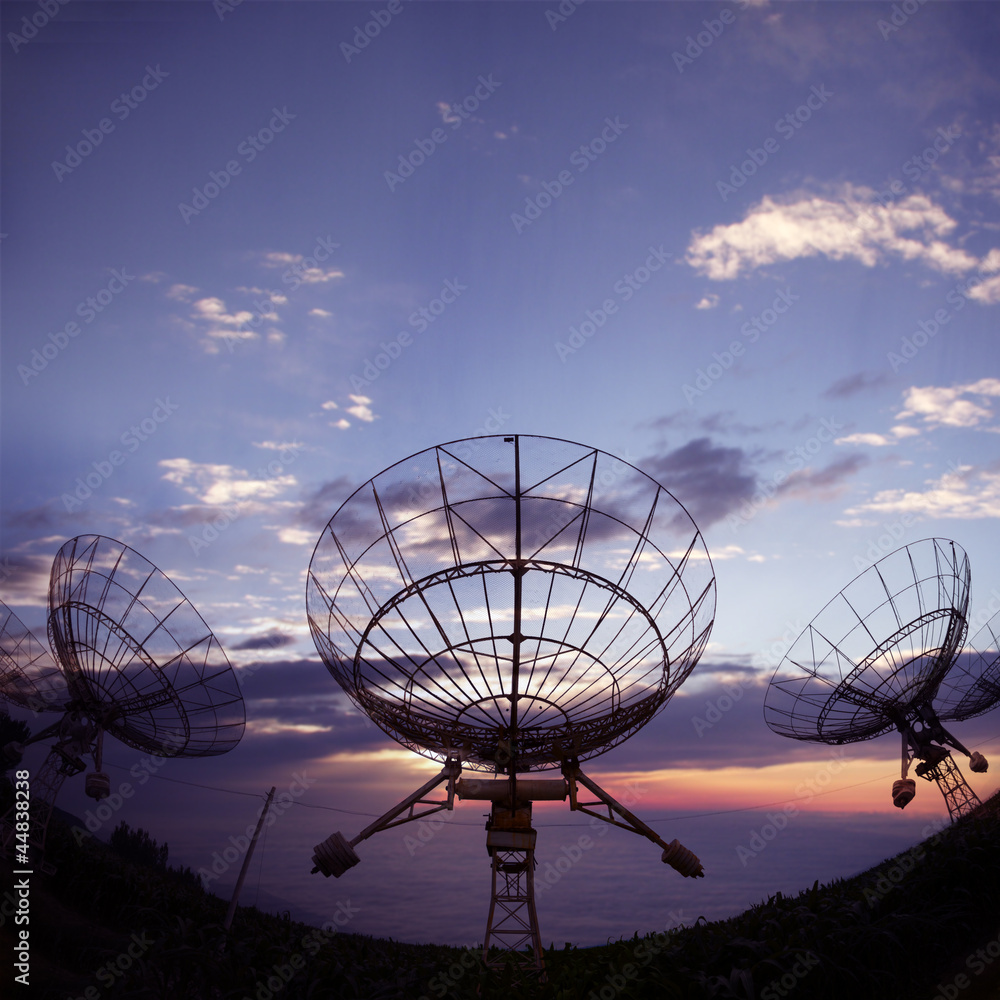 satellite dishes with sunset