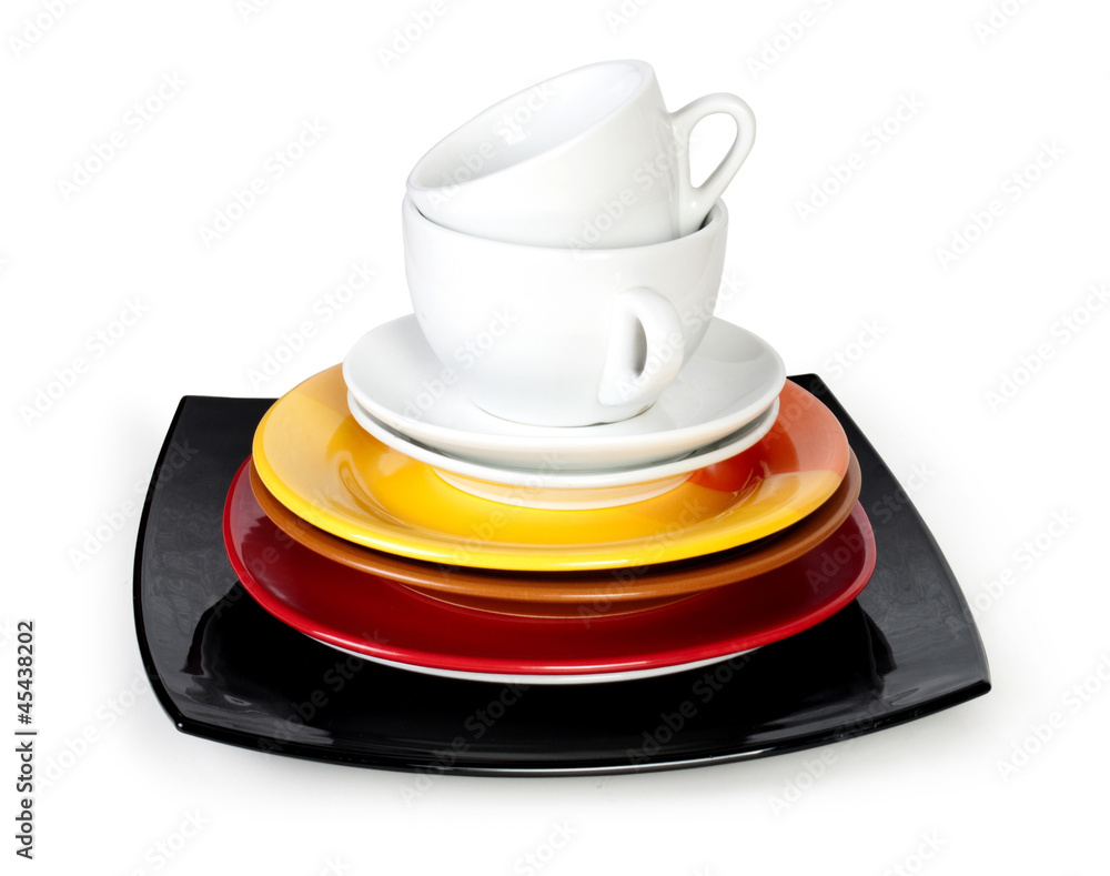 color plates and cups on white background