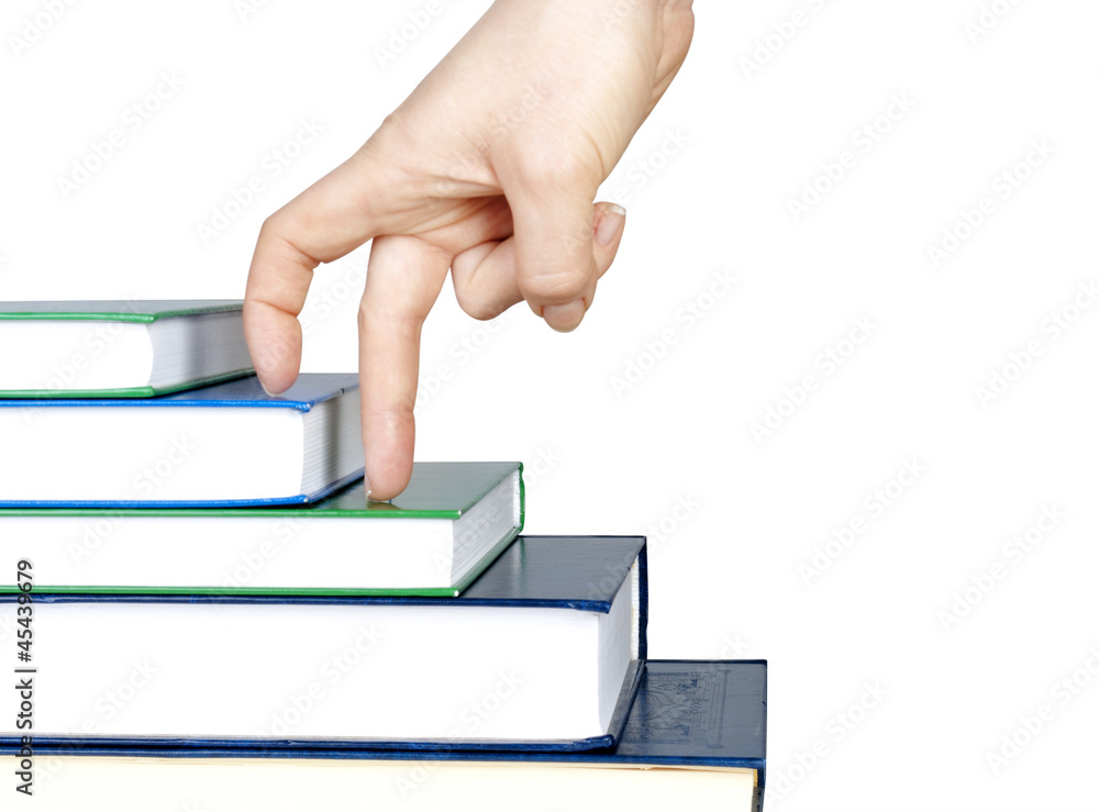 Hand and book stairs isolated on white background