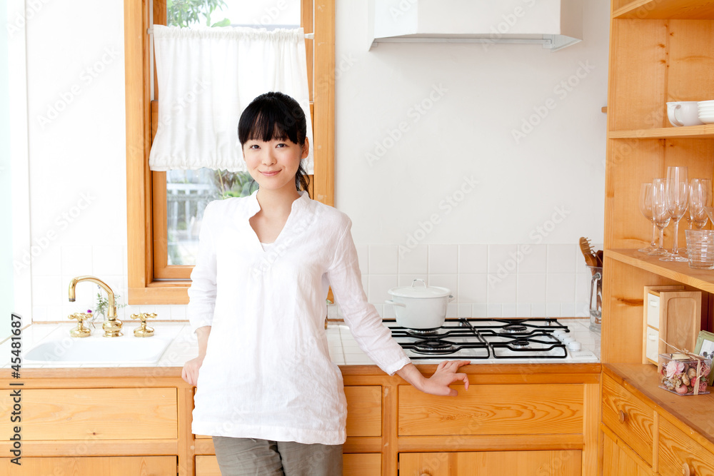 a young asian woman in the kitchen