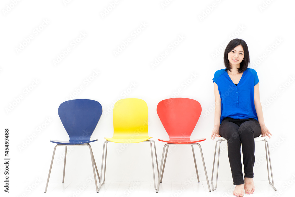 a young asian woman with colorful chair