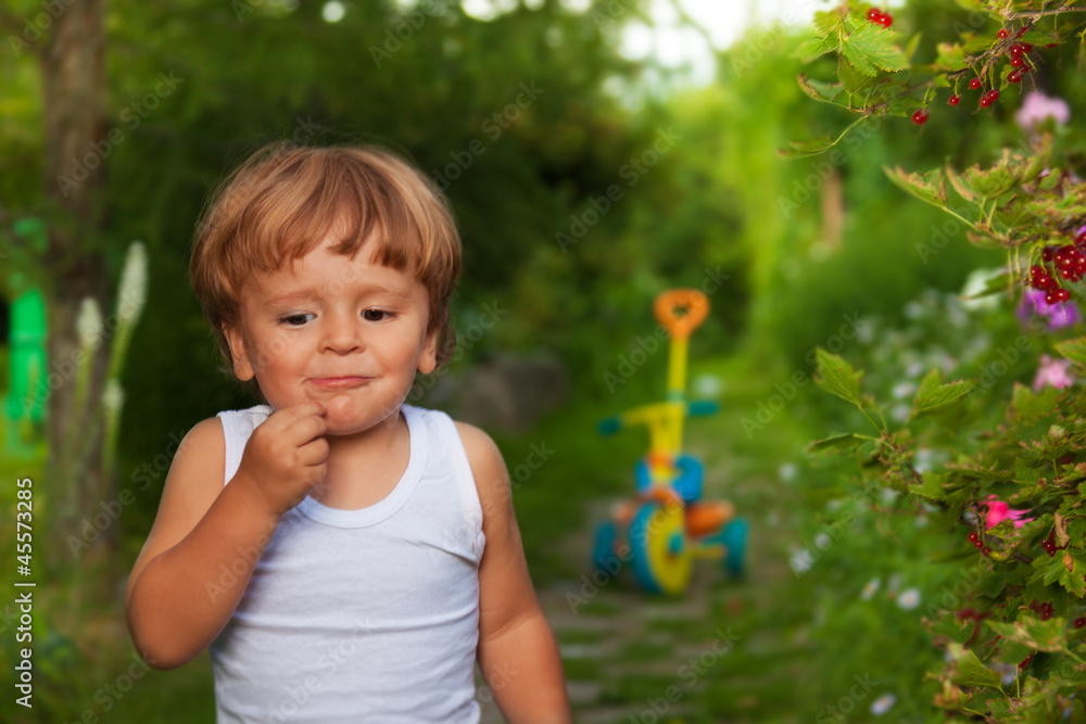 cute kid chewing berries