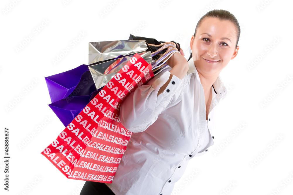 Attractive young female holding shopping bags