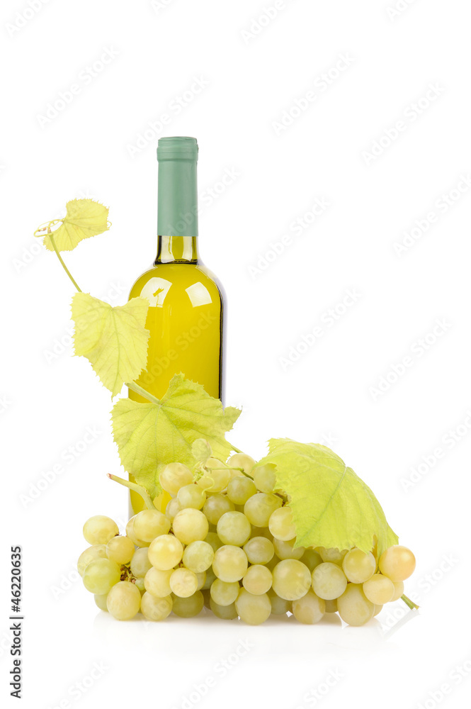 White wine bottle and grapes