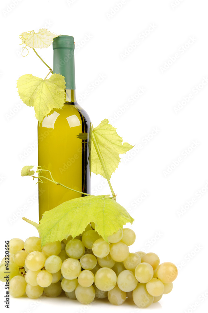 White wine bottle and grapes