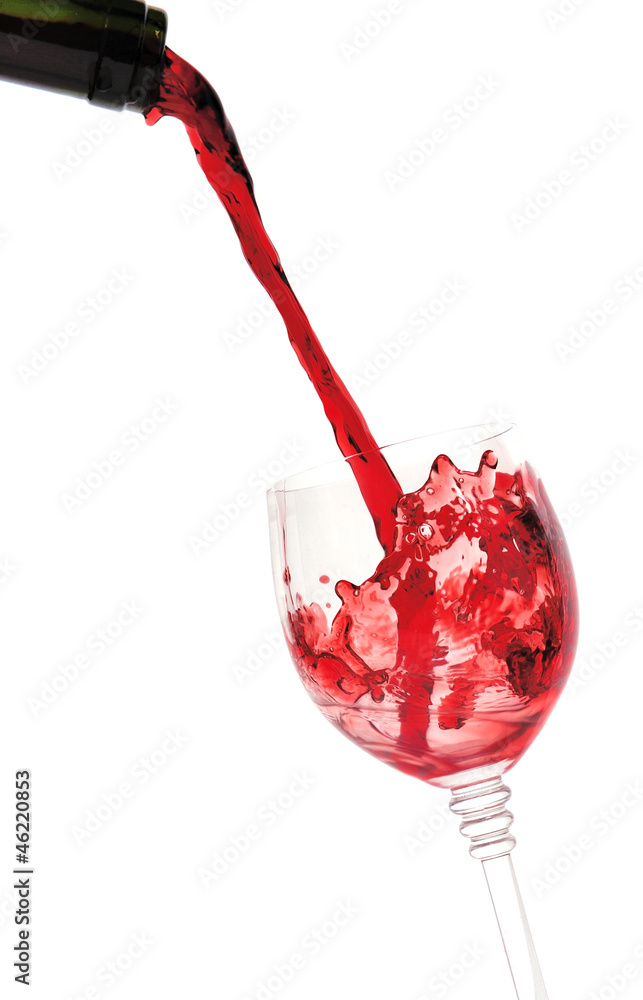 Red wine pouring into wine glass