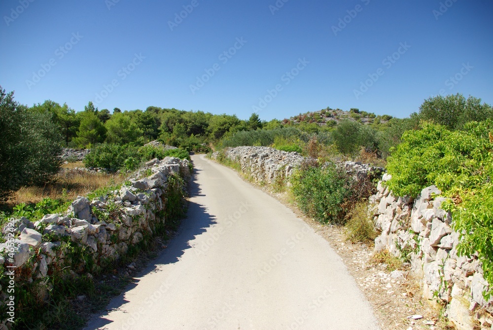 Narrow winding asphalt road between the rocks, Croatia Dalmatia