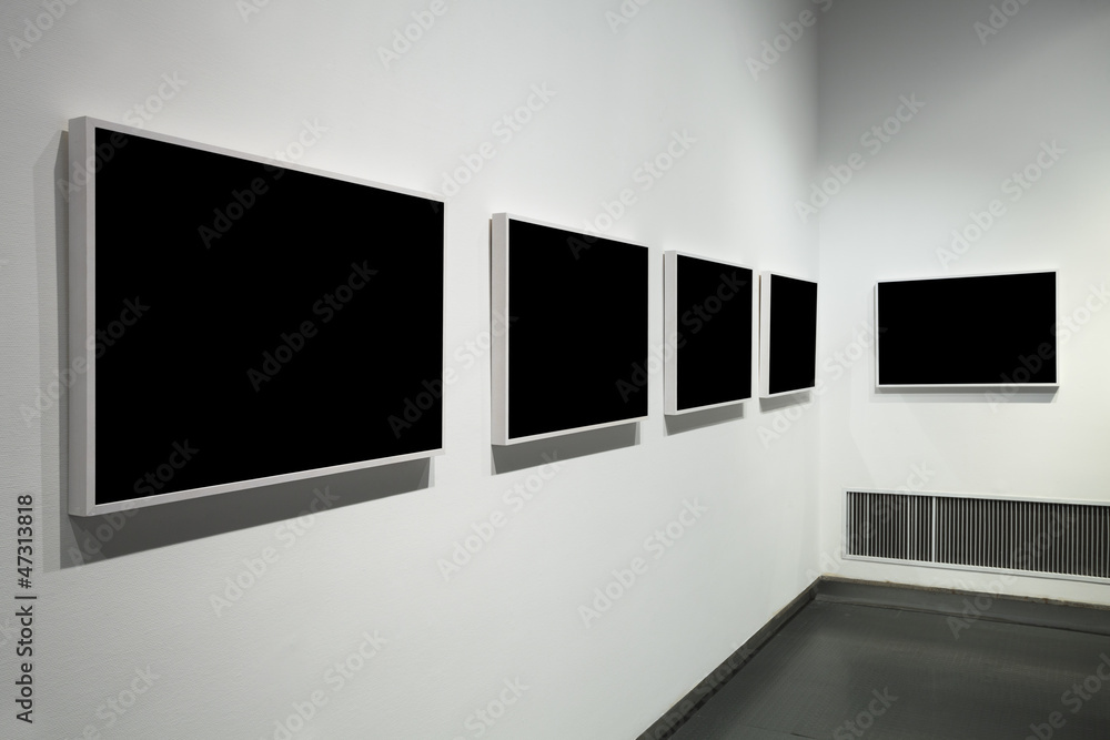 frames on white wall in art museum