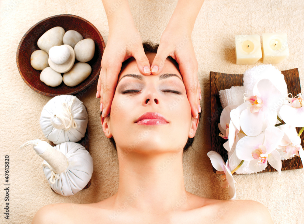 Spa Massage. Young Woman Getting Facial Massage