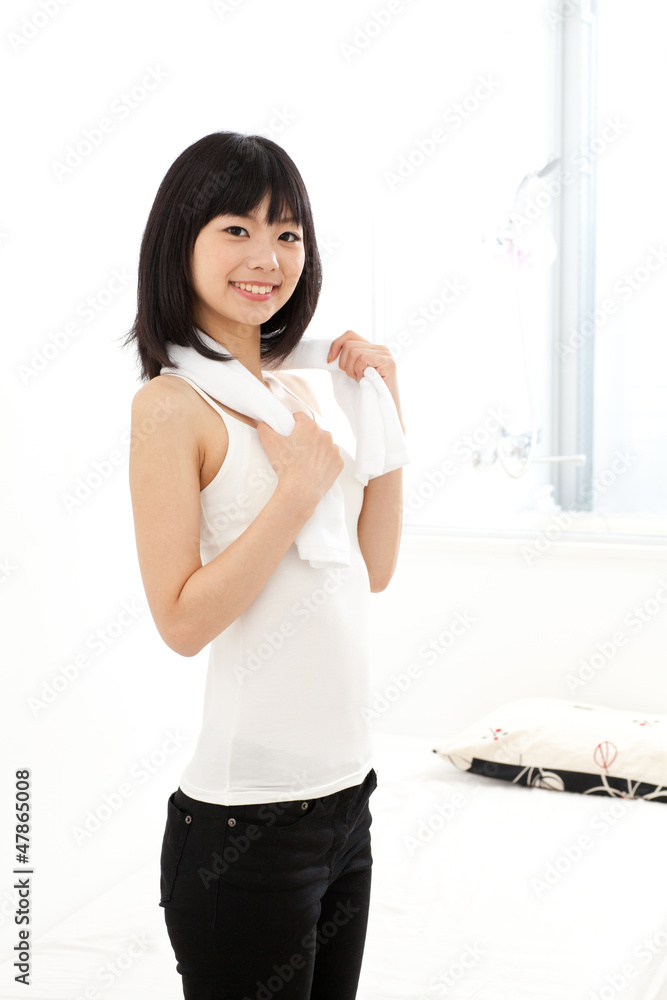 attractive asian woman relaxing in the room