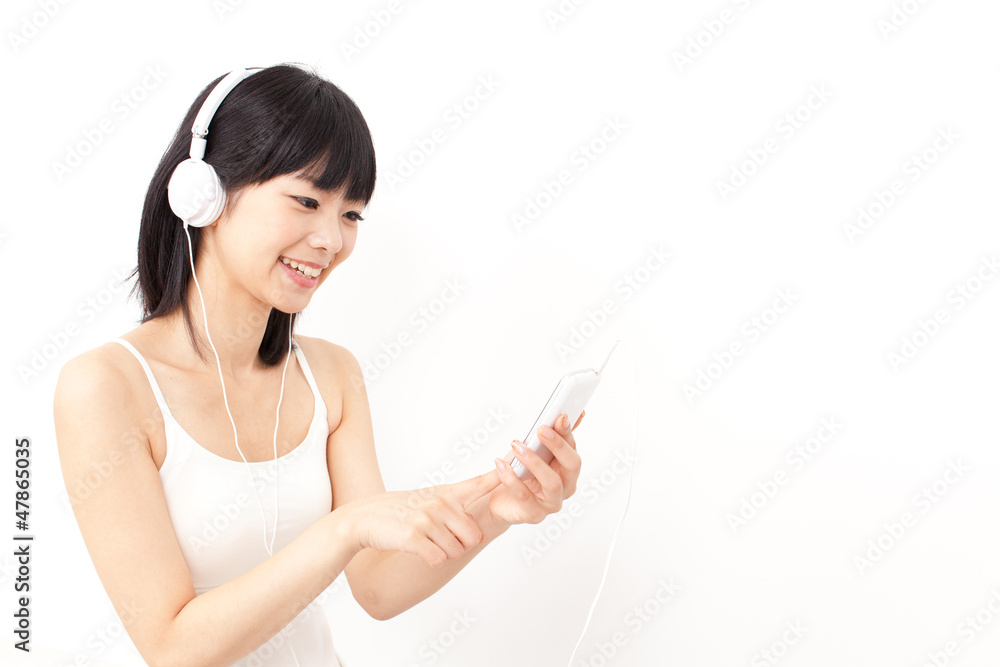 attractive asian woman listening to music