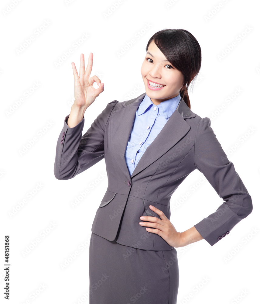 Perfect - business woman showing OK hand sign