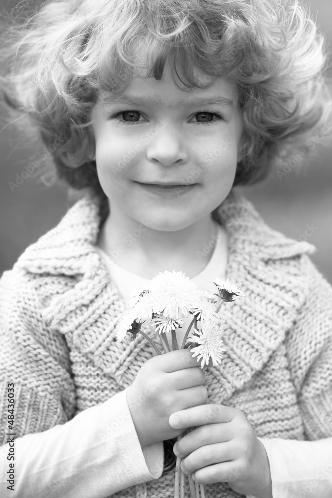 Child with dandelion