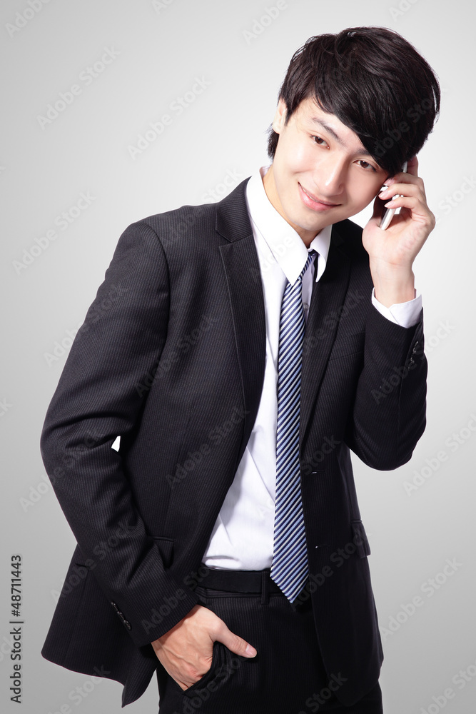 handsome young business man using cell phone