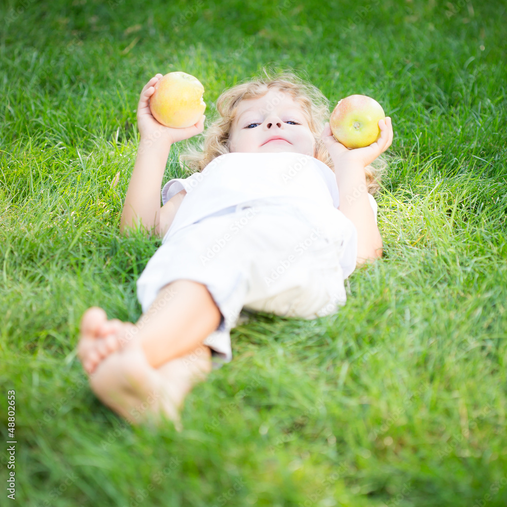 Happy child with apples