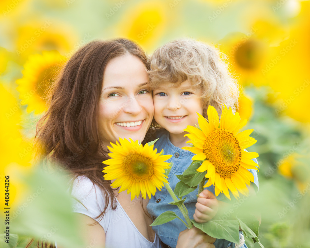 Womn and child in sunflower field