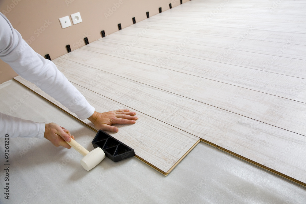 Worker laying laminated