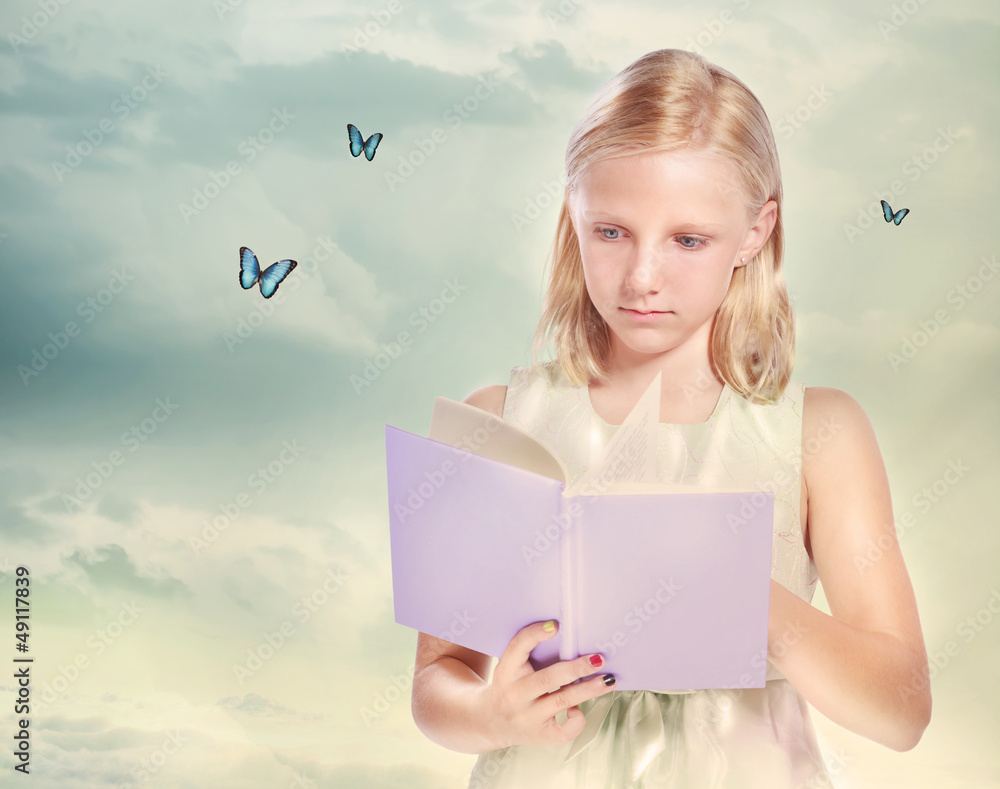 Little Blonde Girl Reading a Book