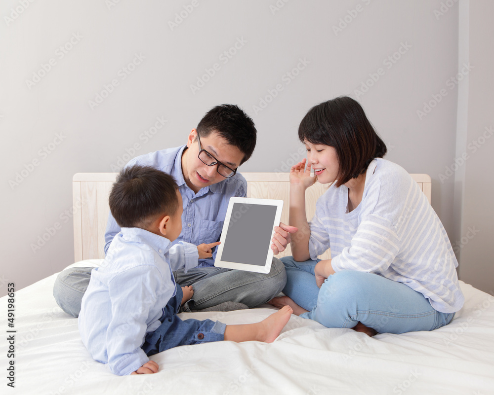 happy family using tablet pc