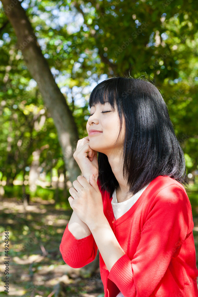 atractive asian woman in the park