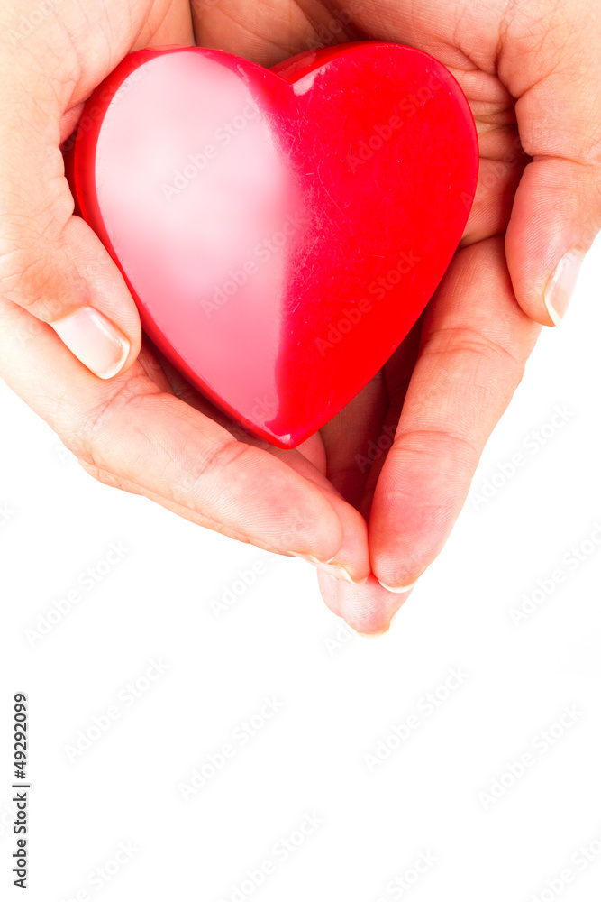 Heart shape in hands as love symbol