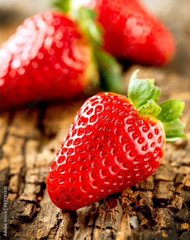 Strawberry over Wooden Background. Strawberries close-up