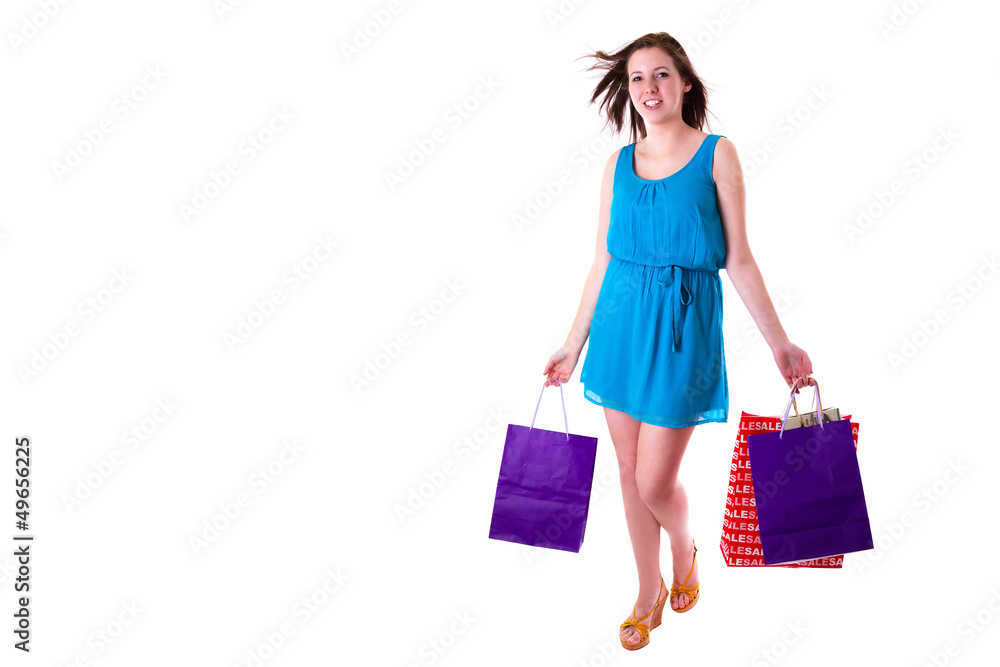 Attractive young female holding shopping bags isolated on white