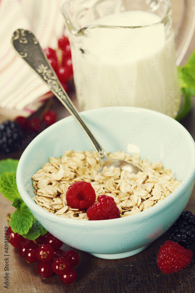 healthy breakfast with bowl of oat flakes