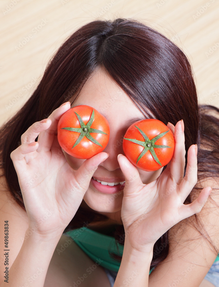 Tomato. funny girl showing tomatos