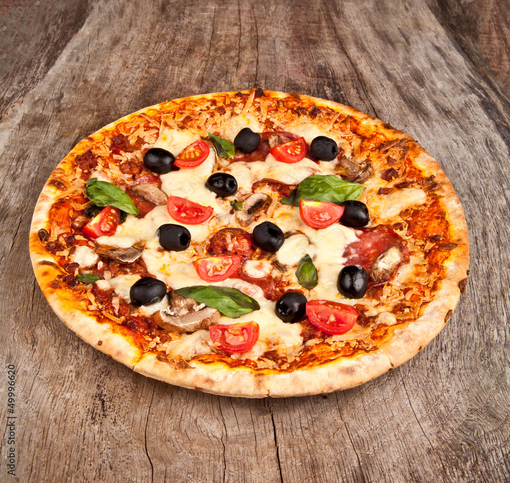 Delicious italian pizza served on wooden table