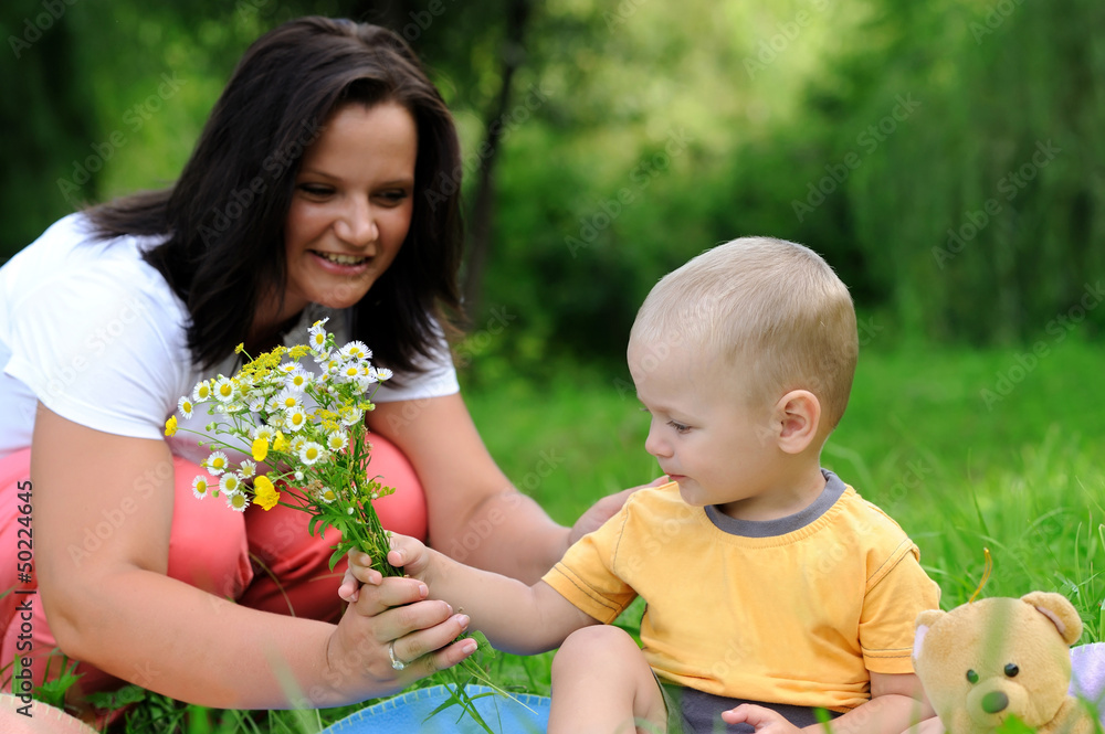 Young mother and daughter in the park