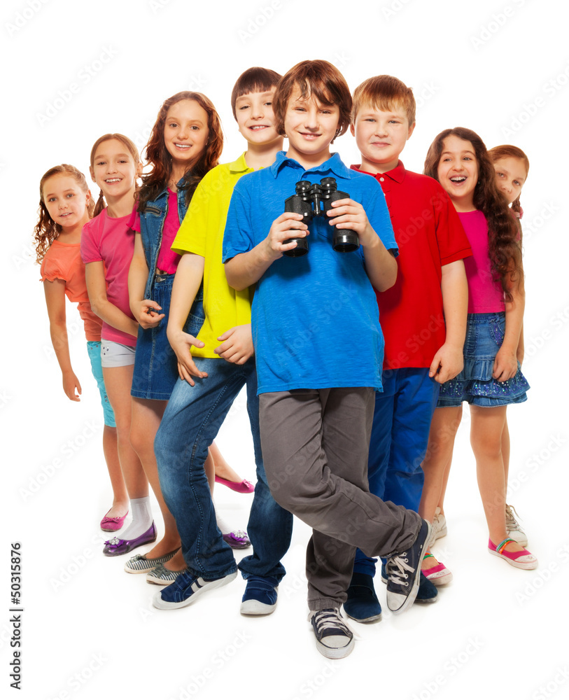 Nice boy with binoculars in a group