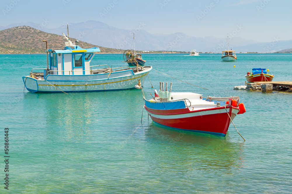 White Greek boats at the coast of Crete