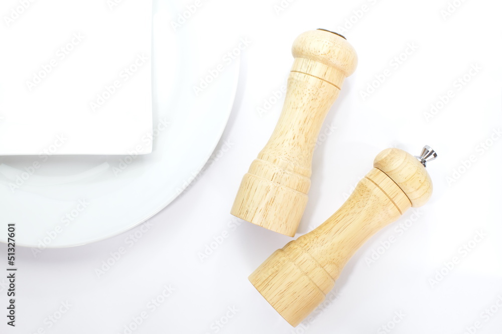 Wood pepper mill and salt shaker isolated on white