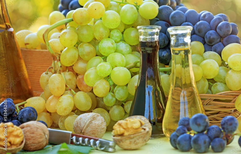 Fresh grapes and wine on the table