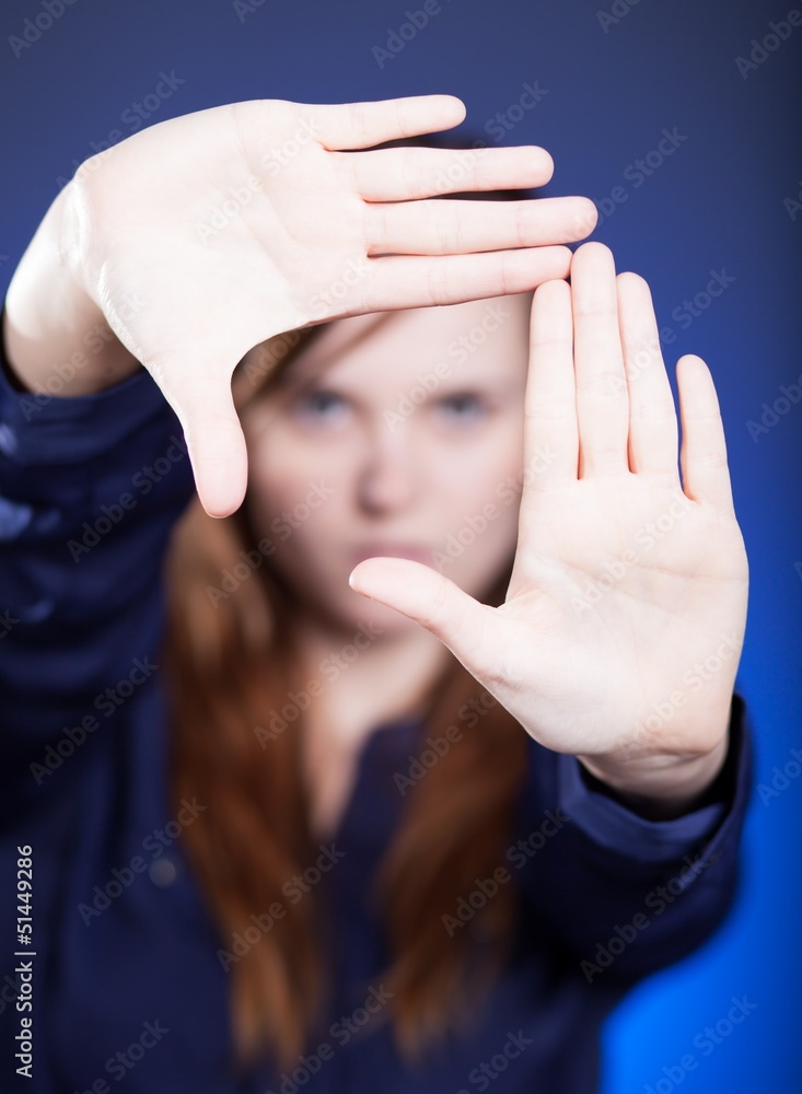 Woman two hands framing composition, forming space