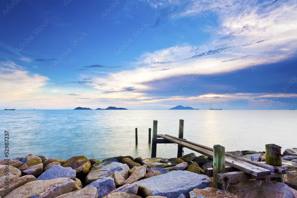 Calm sunset with a jetty