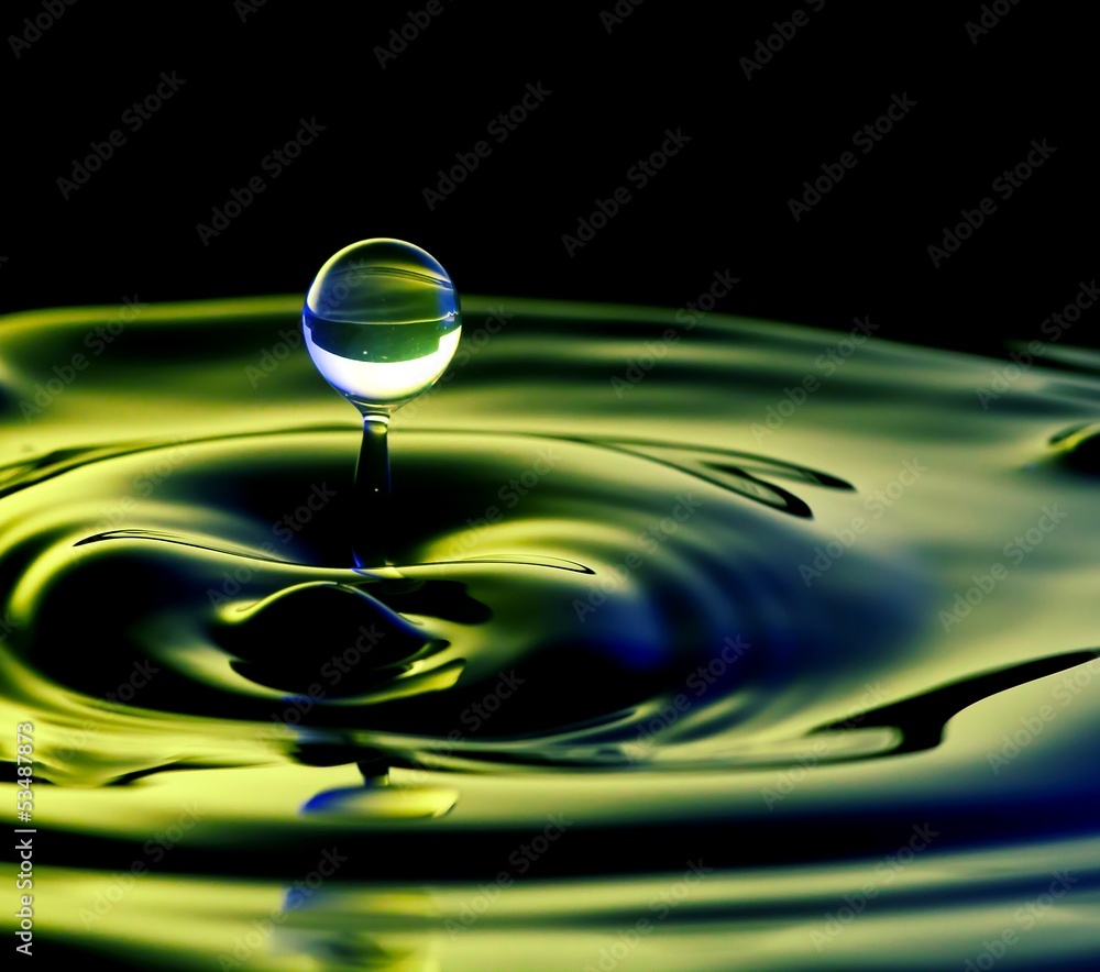 Water surface with flying drops