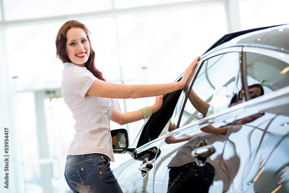 young woman standing near a car