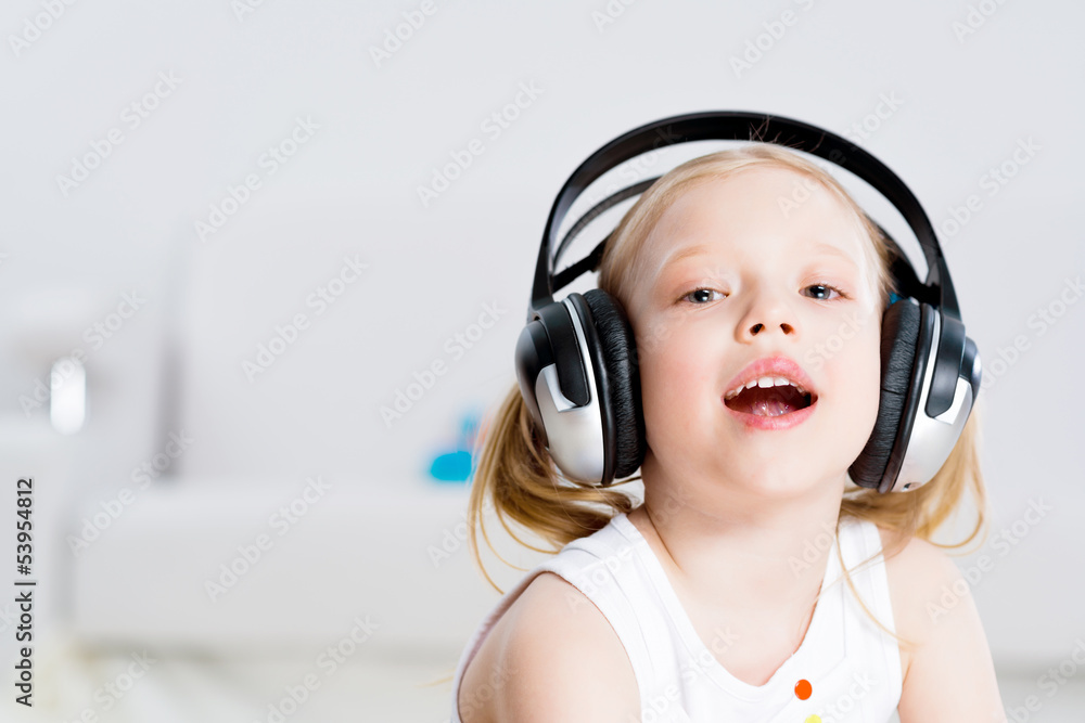 Pretty girl listening to music on headphones