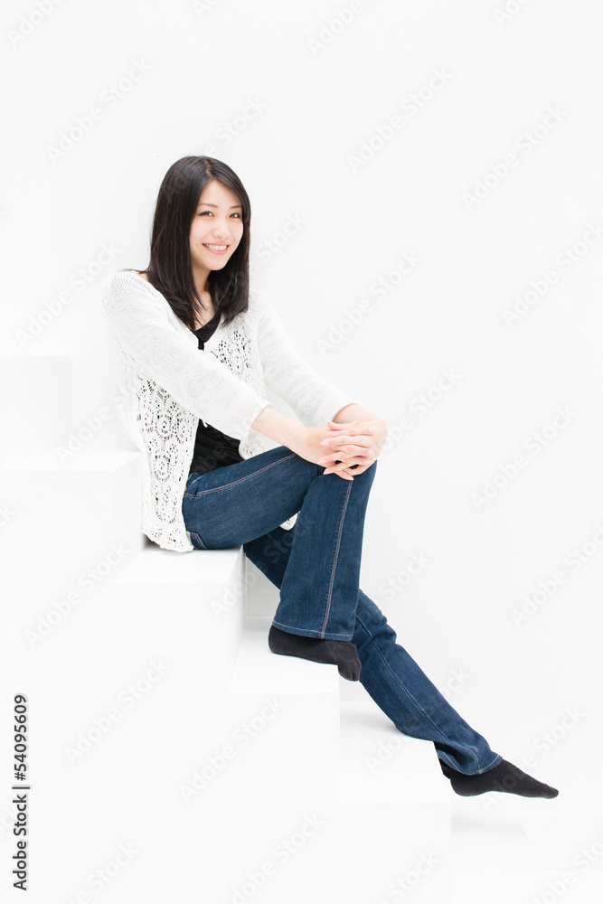 attractive asian woman relaxing on stair