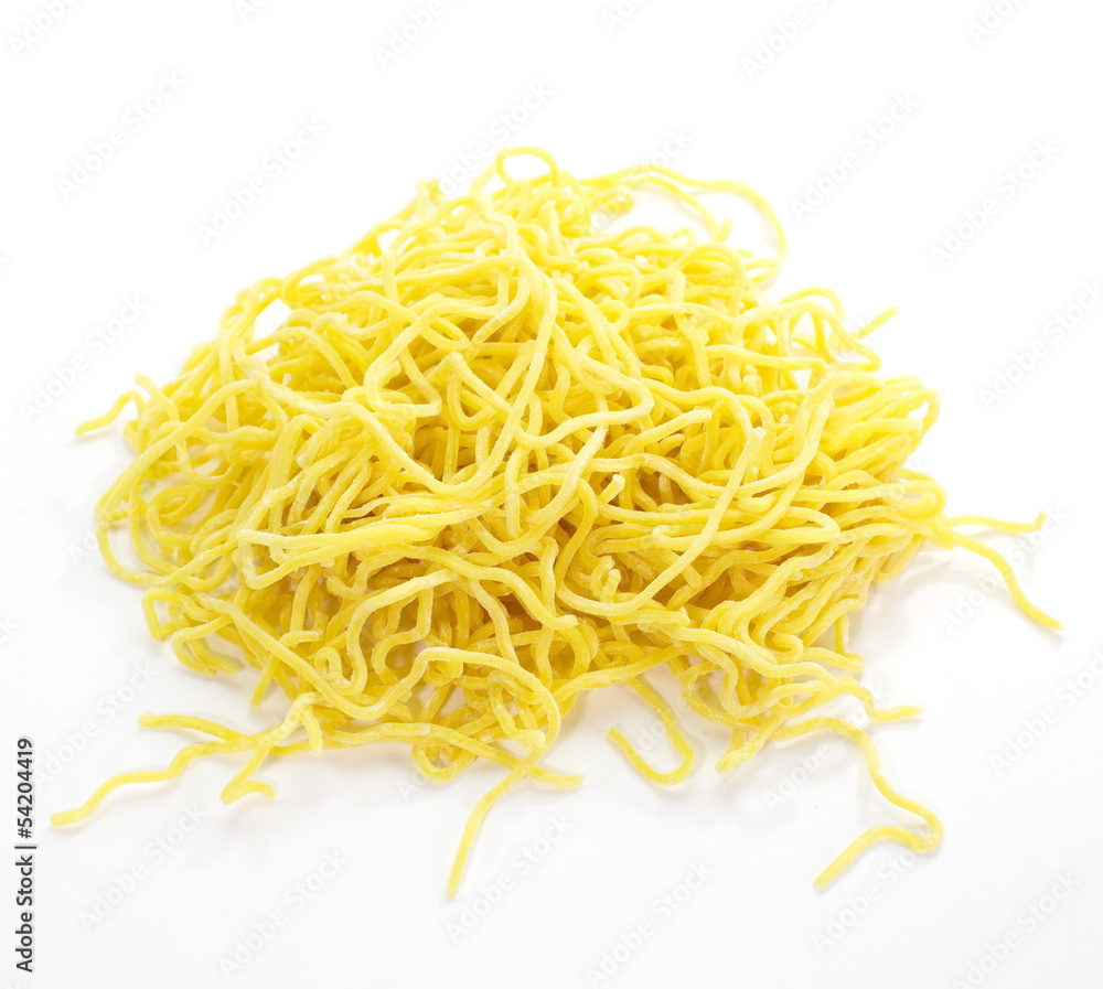 Egg noodles on a white background