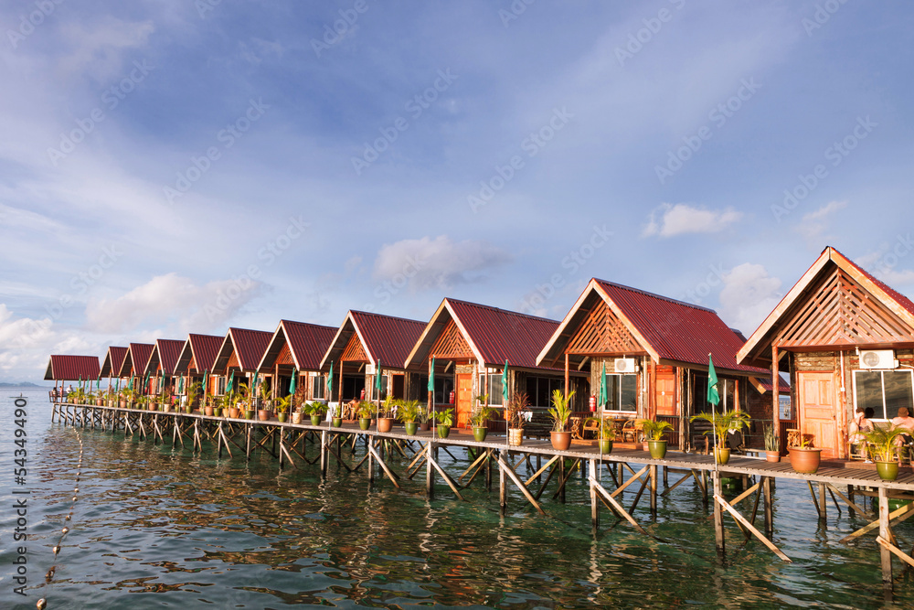 Over water bungalow with bule sky