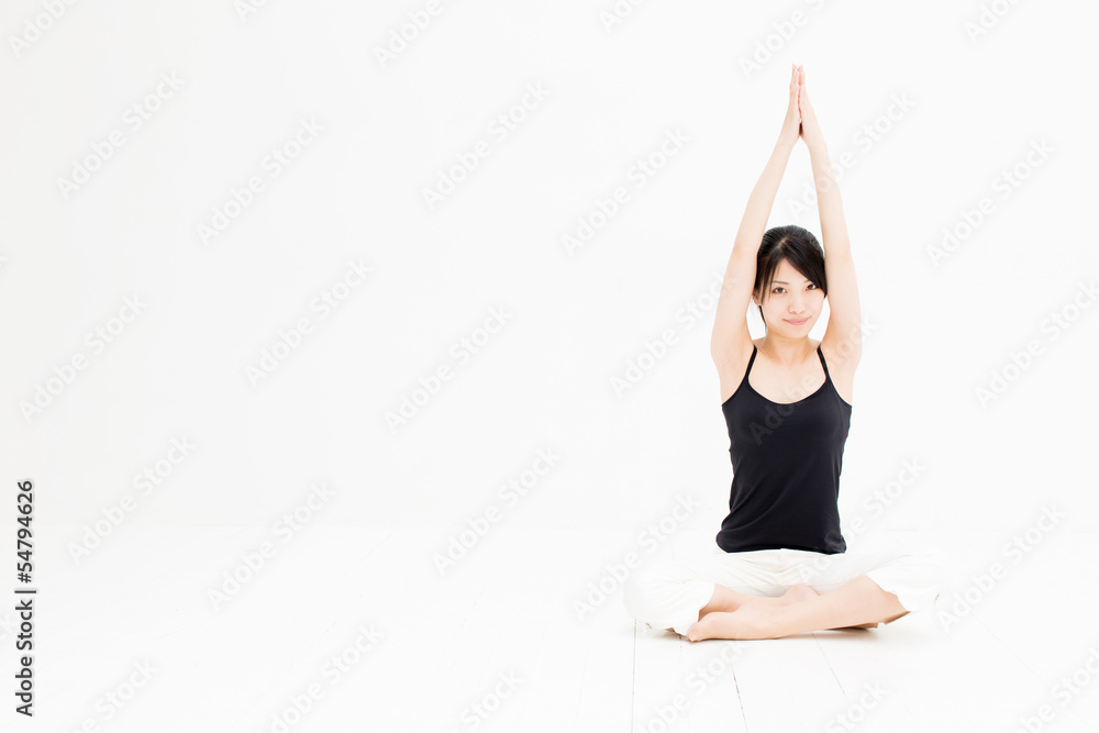 attractive asian woman exercising on white background