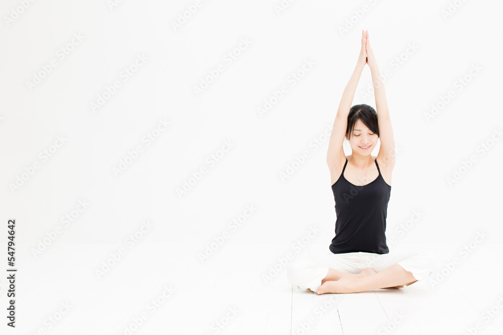 attractive asian woman exercising on white background