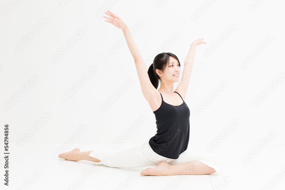 attractive asian woman exercising on white background