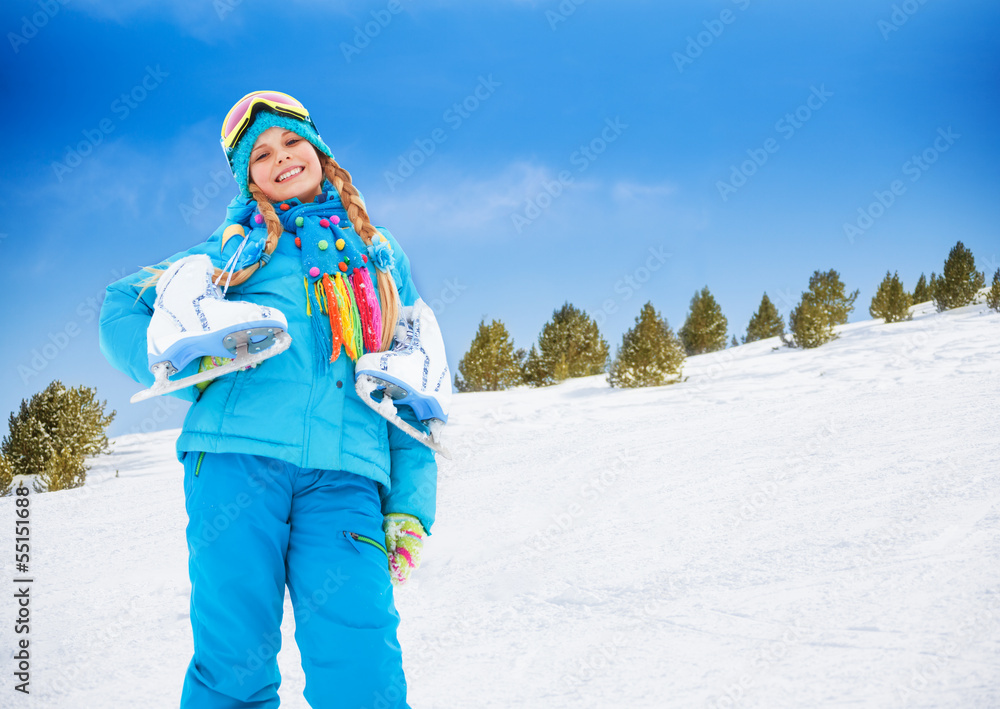 Smiling girl with ice-skates